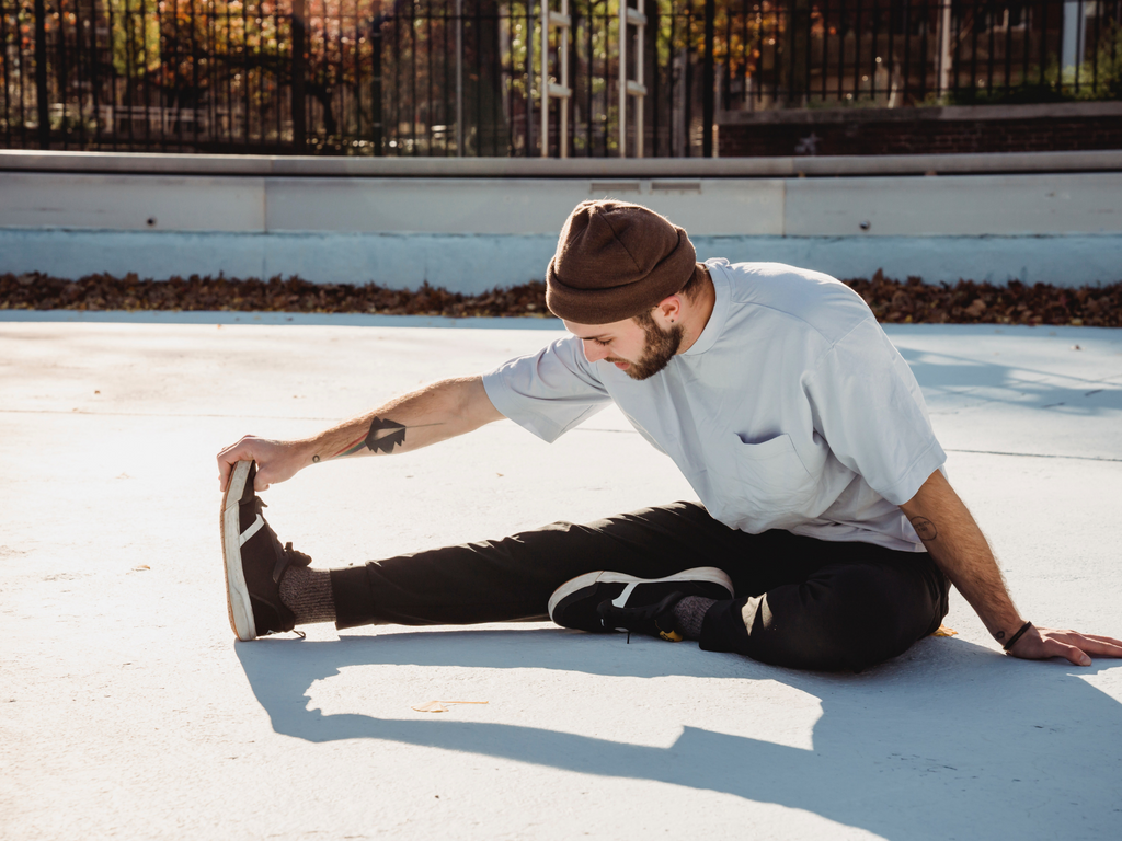 Man Stretching Outside Men's Stretch Class Virtual